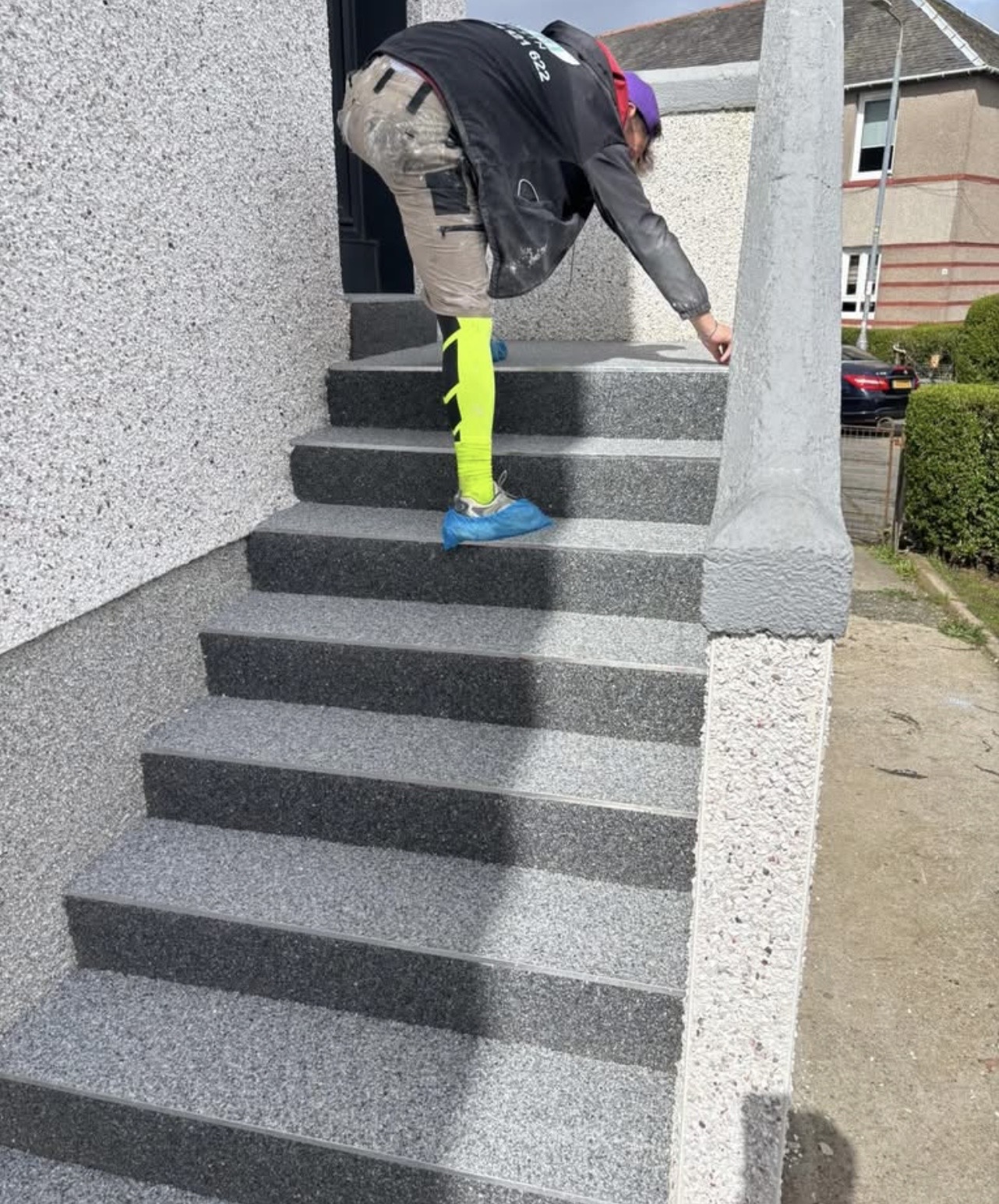 AA Resin Steps installer laying resin on a staircase in Glasgow